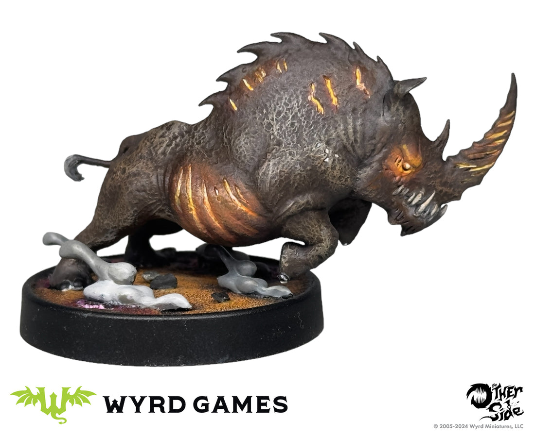 
                    
                      Immolated Rhino from The Other Side Character Box by Wyrd Miniatures, detailed model with fiery, damaged appearance.
                    
                  