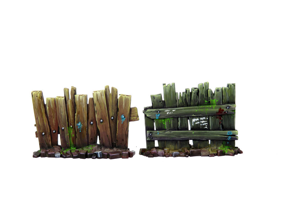 
                    
                      WyrdScapes Makeshift Defenses terrain piece for Malifaux, featuring a detailed makeshift barrier with weathered wood and metal elements.
                    
                  