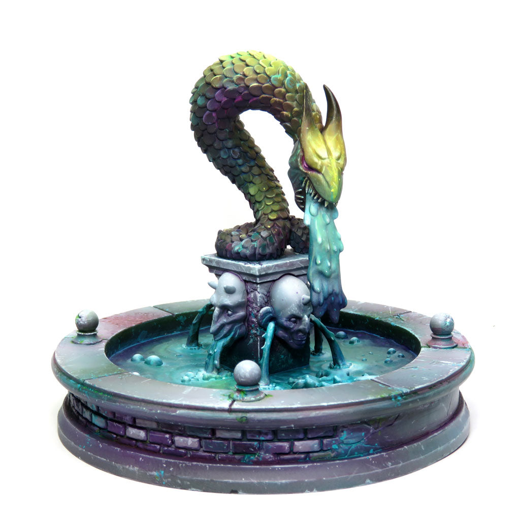 
                    
                      Detailed view of WyrdScapes Makeshift Defenses Malifaux terrain featuring a weathered fountain with stone and metal elements.
                    
                  